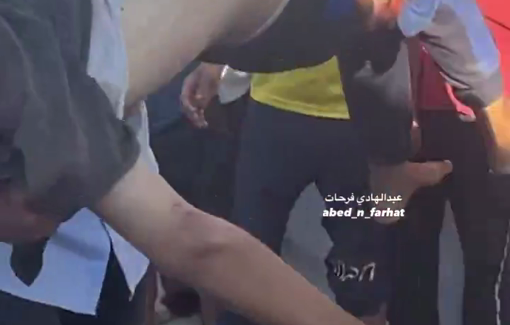 Thumbnail preview image for the video titled: Boy carries older boy killed at Deir al-Balah market