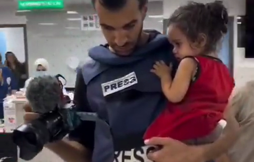 Thumbnail preview image for the video titled: A Palestinian journalist is carrying a lost little girl trembling in fear