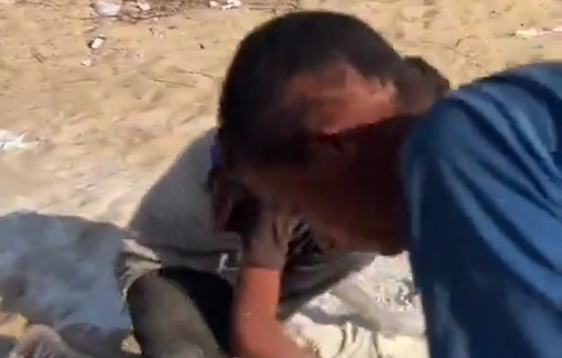 Thumbnail preview image for the video titled: Teen boys pick up spilled flour off the sand to eat later