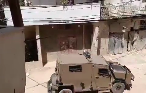 Thumbnail preview image for the video titled: A military bulldozer accompanied by vehicles is deployed at the entrance to Jenin camp