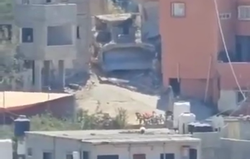 Thumbnail preview image for the video titled: D9 bulldozer destroying part of a house in the Jenin refugee camp