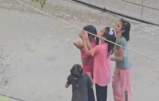 Thumbnail preview image for the video titled: Little girls enjoying the blessing of rain