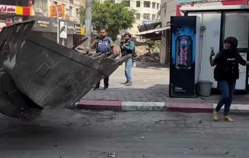 Thumbnail preview image for the video titled: An Israeli military bulldozer attacked Palestinian journalists in Jenin.