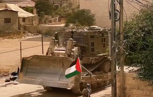 Thumbnail preview image for the video titled: Palestinian man proudly raises his flag in the face of bulldozers