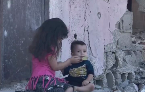 Thumbnail preview image for the video titled: Children become parents. Barefoot little girl feeds her infant brother