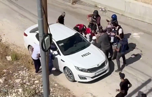 Thumbnail preview image for the video titled: Photojournalists who were covering attacks in the West Bank were directly targeted by Israeli soldiers bullets.