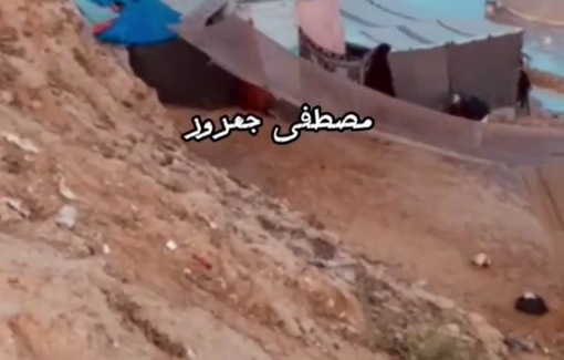 Thumbnail preview image for the video titled: Displaced Palestinians’ tents in Khan Yunis drown in water due to a sea tide.