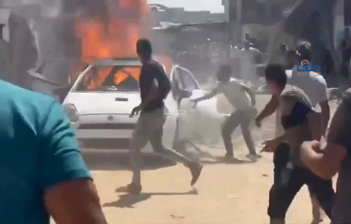 Thumbnail preview image for the video titled: Civilians scramble to douse car set on fire by IDF airstrike