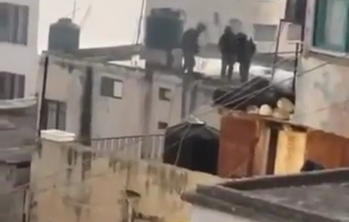 Thumbnail preview image for the video titled: Isareli soldiers threw the bodies of killed Palestinians  from the roof of the besieged house