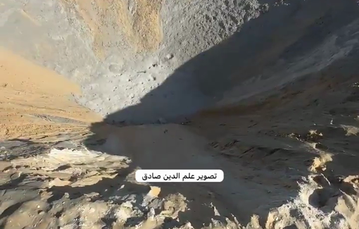 Thumbnail preview image for the video titled: Large crater left by Israeli bombing on tent site in al-Qadisiya