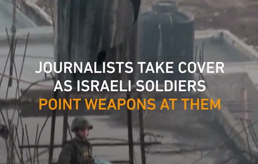 Thumbnail preview image for the video titled: Soldiers point rifles at journalists documenting the building siege in Qabatiya