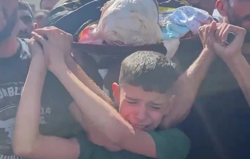 Thumbnail preview image for the video titled: A child cries bitterly during the funeral of one of man killed by Israeli soldiers in Qabatiya