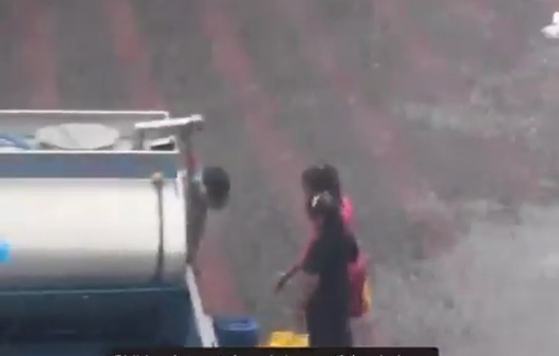 Thumbnail preview image for the video titled: Children play in the rain in a Beit Lahia school turned shelter