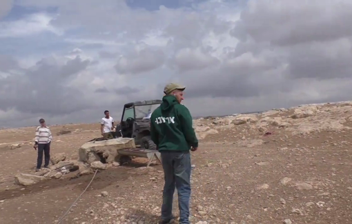 Thumbnail preview image for the video titled: Young settler wears “Our Country” shirt/sweatshirt while stealing private water