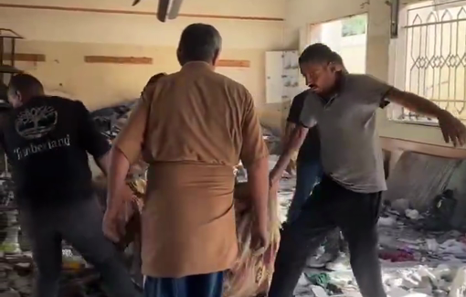 Thumbnail preview image for the video titled: Displaced people collect what remains of their belongings at Musqat school hours after Israeli massacre