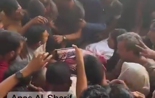 Thumbnail preview image for the video titled: Crowd throngs the body of a man killed at Sheikh Zayed roundabout