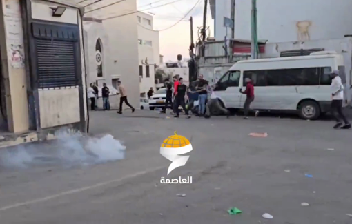 Thumbnail preview image for the video titled: Israeli occupation forces fire tear gas canisters at Palestinian youth during their raid into Qalandia