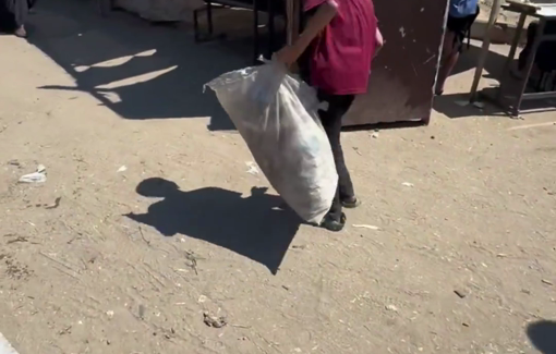 Thumbnail preview image for the video titled: 11 y/o Nahed collects plastic bags to use for fire