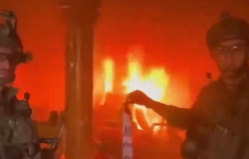 Thumbnail preview image for the video titled: Lt. Yosef Qostin back in may in Rafah burning a Palestinian home in celebration of Lag B’Omer