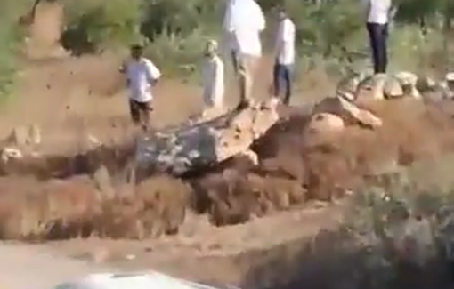 Thumbnail preview image for the video titled: Settlers force Palestinian farmers off their land during the olive harvest in Al-Mughayyir