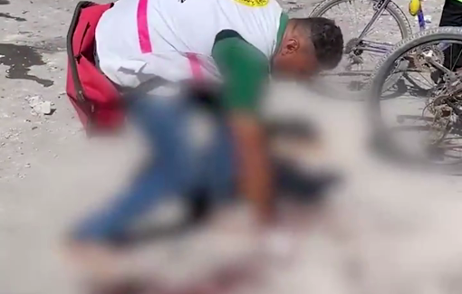 Thumbnail preview image for the video titled: Paramedic picks up body parts in Asmaa School courtyard from IDF bombing