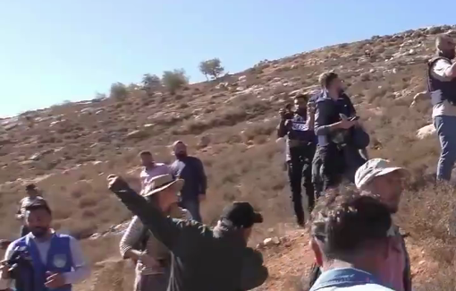 Thumbnail preview image for the video titled: Israeli soldier threatens Burqa farmers: 'if you move, I'll shoot'