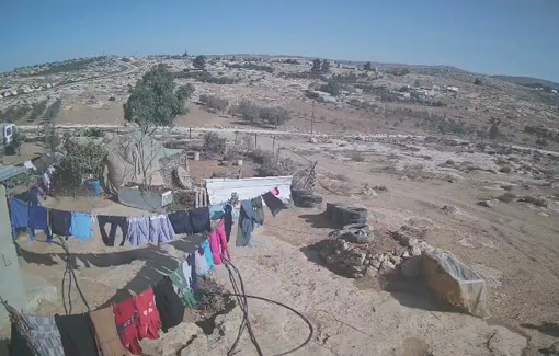 Thumbnail preview image for the video titled: CCTV footage: settlers steal laundry and invade Palestinian property