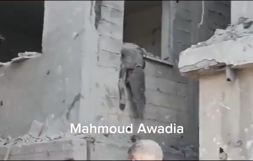 Thumbnail preview image for the video titled: Young girl's body dangling from a window at Abu Nasr house bombed by Israel