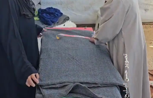 Thumbnail preview image for the video titled: Workshop making clothes for the displaced from blankets