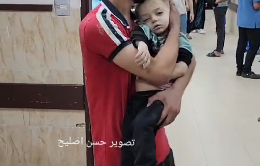 Thumbnail preview image for the video titled: Young father holds his baby injured in Israeli bombing of Mohandisin Tower