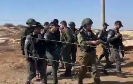 Thumbnail preview image for the video titled: Israli soldiers and police officers from the Border Police prevent Palestinian harvesting in olive groves in Am Nir / Susiya