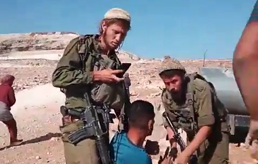 Thumbnail preview image for the video titled: 2 Israeli settlers beat and harass a shepherd in al-Mania near Bethlehem