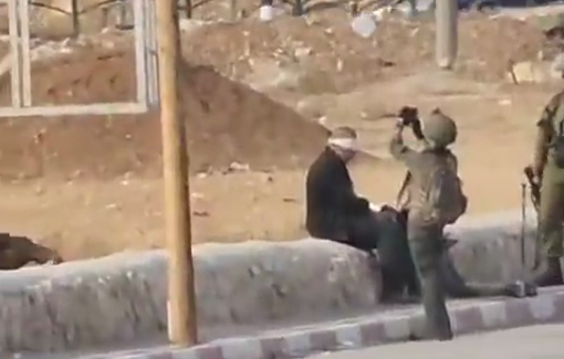 Thumbnail preview image for the video titled: Israeli soldiers arrest two youths and raise the israeli flag near the entrance of Palestinian Fawwar camp