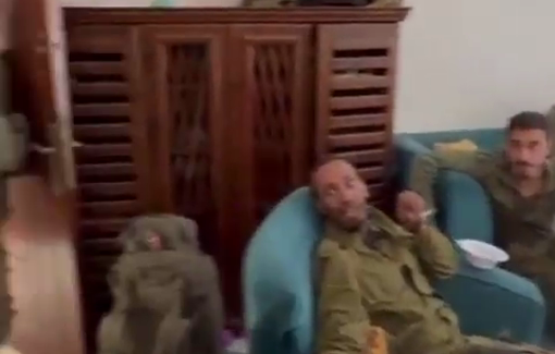 Thumbnail preview image for the video titled: Soldiers loiter in a Lebanese home bonding over a looted guitar and smoking