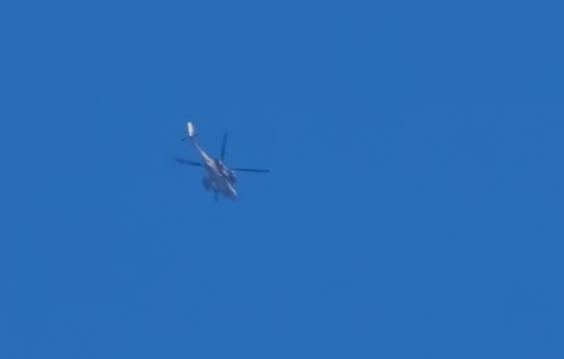 Thumbnail preview image for the video titled: Helicopter launches missile towards tents in Deir al-Balah