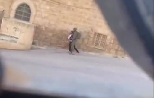 Thumbnail preview image for the video titled: Israeli soldier assaults a young Palestinian with special needs in Hebron